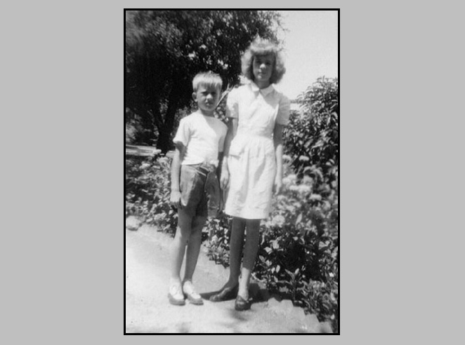 <terry and adrienne posed by bushes may be on a trip to port lavaca>