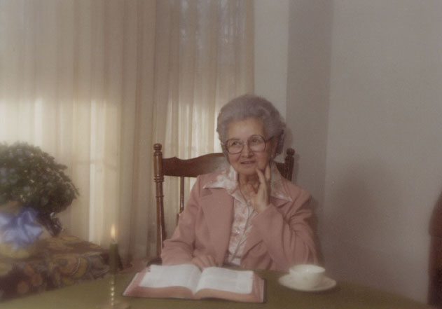 <mom johnie posed with flowers from adron dad's funeral>