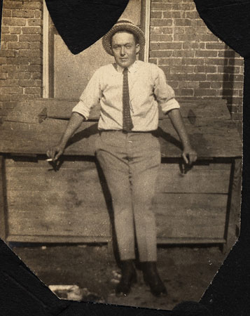 <man wearing a straw boater restored by terry>