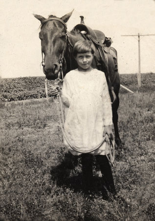 <Eddie May leading a horse restored by terry>