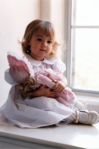 <rebecca with doll in the window raleigh road>