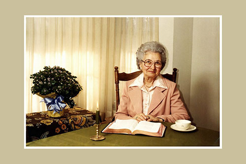 <mother with adron's funeral flowers>