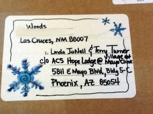 <presents lenzo las cruces woods las cruces thank you kingman and kaye for the flowers terry and kelly's digs hospital chair bed terry's nature walk cross made from rocks rose in front of mayo terry with mayo in background janell writing letter filling out menu red house coat robe cubicin farricielli dr yee sandra memorial medical center las cruces>